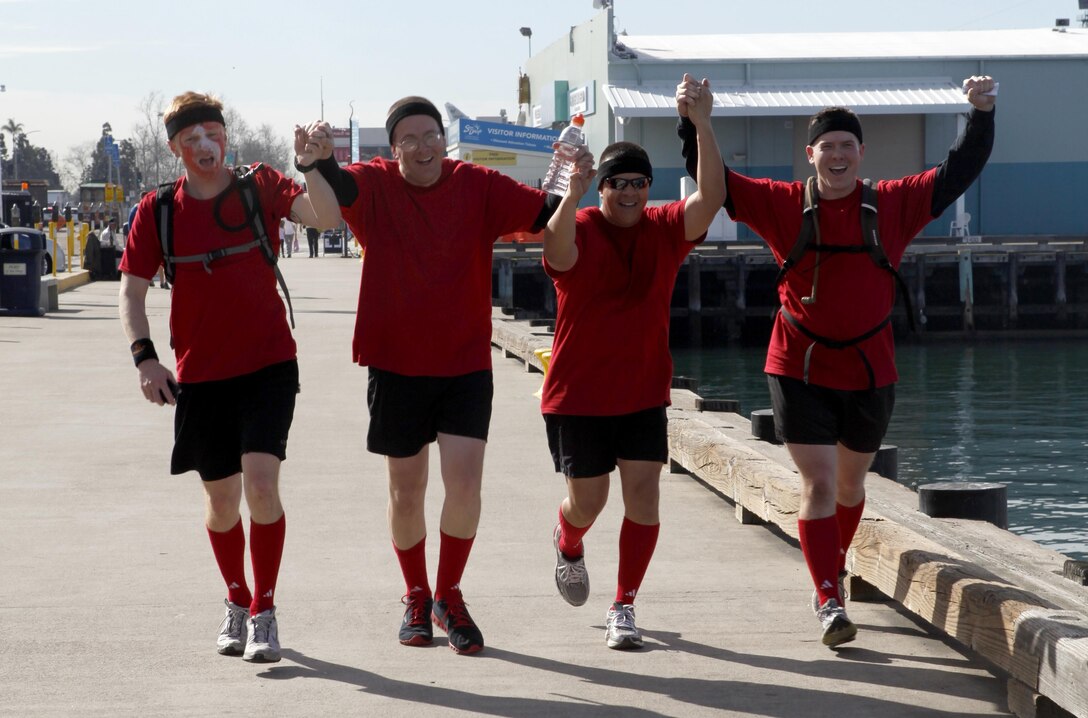 SAN DIEGO – Marines cross the finish line in San Diego after completing a six-mile relay race consisting of ten checkpoints, Feb. 15. Marine Heavy Helicopter Squadron 465 “Warhorse” held the race for staff non-commissioned officers and officers to compete and increase unit morale.