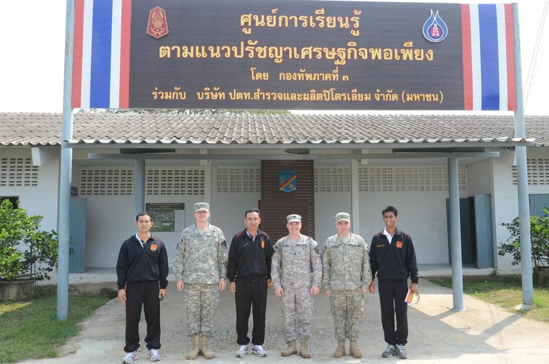 Members of the Royal Thai Army, 104th Heavy Artillery Battalion, and members of the U.S. Army 2nd Battalion, 9th Infantry Regiment, 1st Armored Brigade Combat Team, 2nd Infantry Division, pose for a group photo during a tour of the â€œKingâ€™s Projectâ€ farm on Camp A in Phitsanulok province, Kingdom of Thailand, Feb. 9, prior to the start of exercise Cobra Gold 2013. Joint and multinational training is vital to maintaining the readiness and interoperability of all participating military forces. The tour included visiting centers, which housed incubators and pens for growing baby chicks and spanned out across the camp to include livestock, soil preparation centers and even alligator pens.