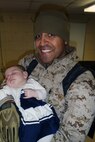 Staff Sgt. Luis A. Rogers, a Sunrise, Fla., native and utilities chief with Combat Logistics Battalion 2, 2nd Marine Logistics Group, holds his daughter, Emmali Grace, for the first time shortly after returning to Camp Lejeune, N.C., Feb. 1, 2013. Emmali Grace was born Nov. 2, 2012, while Luis was deployed to Afghanistan supporting logistical operations. 