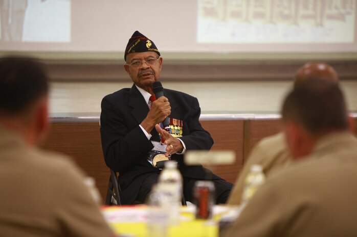 Turner G. Blount, one of the original Montford Point Marines, answers questions about his time in the military during a Black History Month celebration hosted by 2nd Medical Battalion, 2nd Marine Logistics Group aboard Camp Lejeune, N.C., Feb. 15, 2013. Blount faced racial discrimination and segregation when he joined the Marine Corps during World War II.