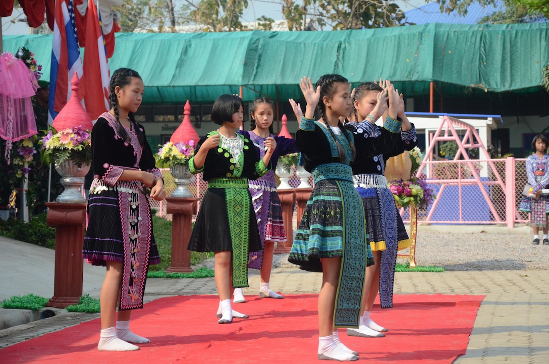 Students from the Ban Piang Elementary School perform a traditional Thai dance for attendees during the dedication ceremony of a new multipurpose building at the school in San Pa Tong district, Chiang Mai province, Kingdom of Thailand Feb. 18. During the ceremony, attendees celebrated the building constructed by multinational forces during an engineering civic assistance project, part of exercise Cobra Gold 2013. Cobra Gold, in its 32nd iteration, is designed to advance regional security by joining multinational forces together in partnership to solve regional challenges.