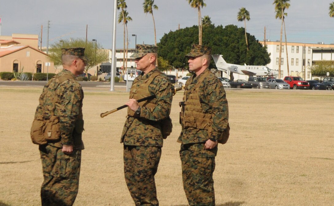On Feb. 11, Sgt. Maj. Robert Pullen relinquished his duties as acting sergeant major of Yuma-based Marine Aviation Logistics Squadron 13 to his successor Sgt. Maj. Lonny Solari during a relief and appointment ceremony at the parade deck at Marine Corps Air Station Yuma. The passing of a ceremonial NCO sword signifies the transfer of sacred trust from one sergeant major to another.