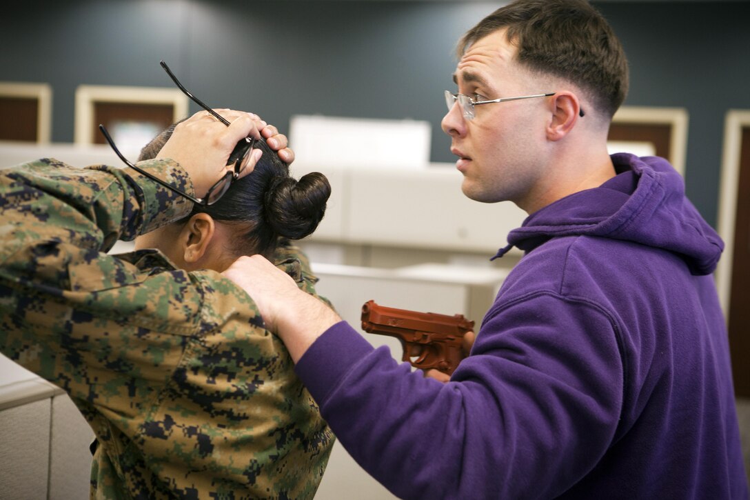 Sgt. Alex Bolicke, training non-commissioned officer for Headquarters Battalion, Marine Forces Reserve acts as a gunman in an active-shooter drill held at the Marine Corps Support Facility New Orleans Feb. 7, 2013. The drill was a part of safety preparation for the support facility that included classroom time, leadership discussion and facility-wide drills. (U.S. Marine Corps photo by Cpl. Marcin Platek/Released)