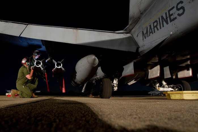 Before sunrise, aviation ordnance Marines load a Guided Bomb Unit 12 onto an F/A-18D to be used later that day as a part of bilateral training with Wing One Royal Thai Air Force pilots during exercise Cobra Gold 2013 at Wing One Royal Thai Air Force Base, Nakhon Ratchasima, Kingdom of Thailand, Feb. 17. CG 13 is a multilateral exercise and develops multinational solutions to common challenges. The Marines are with Marine All Weather Fighter Attack Squadron 224, Marine Aircraft Group 12, 1st Marine Aircraft Wing, III Marine Expeditionary Force.