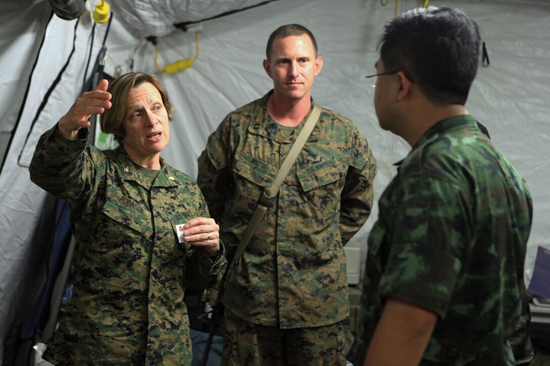 Navy Capt. Allison Robinson (left), general surgeon with 3rd Medical Battalion, III Marine Expeditionary Force, and a native of Big Pine, Calif., speaks with Royal Thai Army Col. Samai Khampan, director of the Royal Thai Army Fort Phichaidaphak Hospital in Uttaradit, about the capabilities of the 31st Marine Expeditionary Unit's forward resuscitative surgical suite here, Feb. 16. The RTA medical visit helps the U.S. medical staff set protocols for the treatment of any incoming Thai personnel during exercise Cobra Gold 2013. CG13, now in its 32nd iteration, allows U.S. forces to collaborate with partner countries to achieve mutual security goals, address shared concerns, and continue to develop and enhance relationships.
