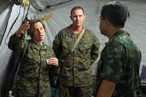 Navy Capt. Allison Robinson (left), general surgeon with 3rd Medical Battalion, III Marine Expeditionary Force, and a native of Big Pine, Calif., speaks with Royal Thai Army Col. Samai Khampan, director of the Royal Thai Army Fort Phichaidaphak Hospital in Uttaradit, about the capabilities of the 31st Marine Expeditionary Unit's forward resuscitative surgical suite here, Feb. 16. The RTA medical visit helps the U.S. medical staff set protocols for the treatment of any incoming Thai personnel during exercise Cobra Gold 2013. CG13, now in its 32nd iteration, allows U.S. forces to collaborate with partner countries to achieve mutual security goals, address shared concerns, and continue to develop and enhance relationships.
