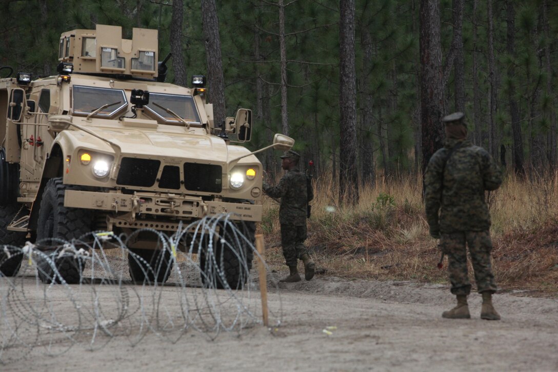 A Marine with 2nd Supply Battalion, Combat Logistics Regiment 25, 2nd Marine Logistics Group provides security at the battalion’s campsite during a field exercise aboard Camp Lejeune, N.C., Feb. 7, 2013. The unit ran a series of convoy operations and patrols designed to test its ability to support 10th Marine Regiment, 2nd Marine Division’s upcoming role in Rolling Thunder.