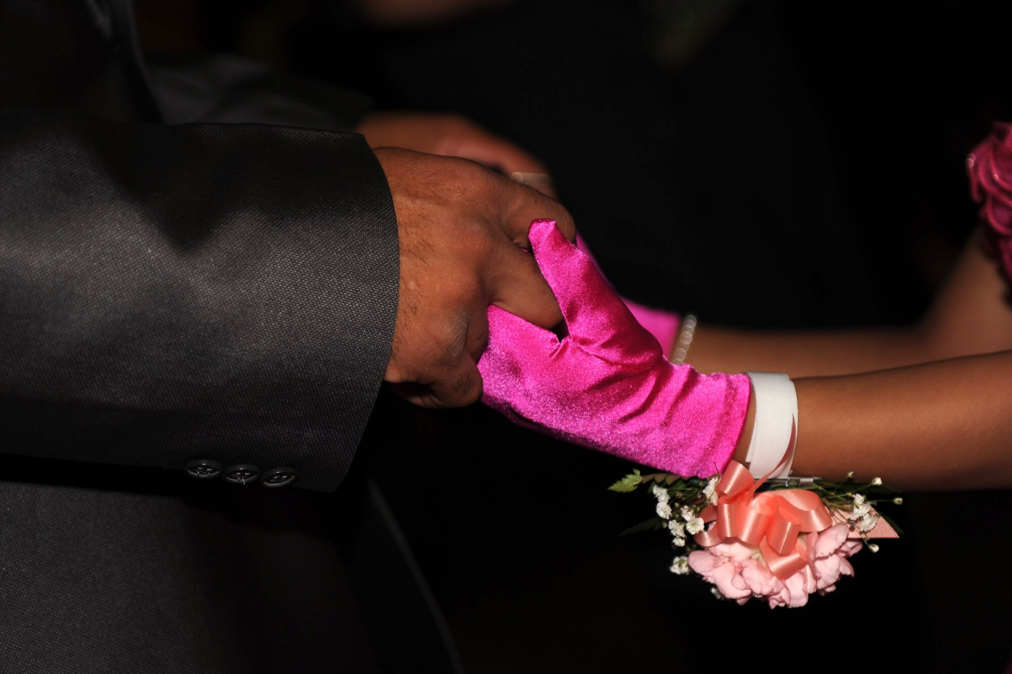 A father holds his daughter’s hands as they danced at the father-daughter dance on Kadena Air Base, Japan, Feb. 16, 2013. The event was the second father-daughter dance held by the Shogun Defenders, an 18th Security Forces Squadron booster club, and was held to bring fathers and daughters together for an afternoon of dancing, games and decorating cupcakes and other crafts. (U.S. Air Force photo/Airman 1st Class Hailey R. Davis)