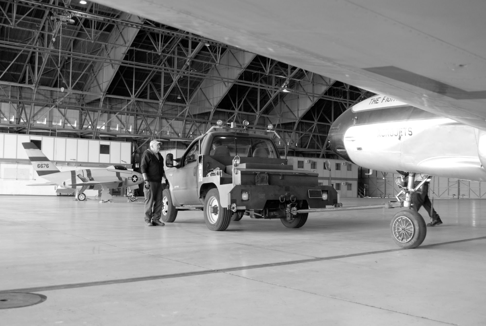 Volunteers prepare to relocate the P-80 Shooting Star to Hangar 1864. (U.S. Air Force Photo by Laura Mowry)