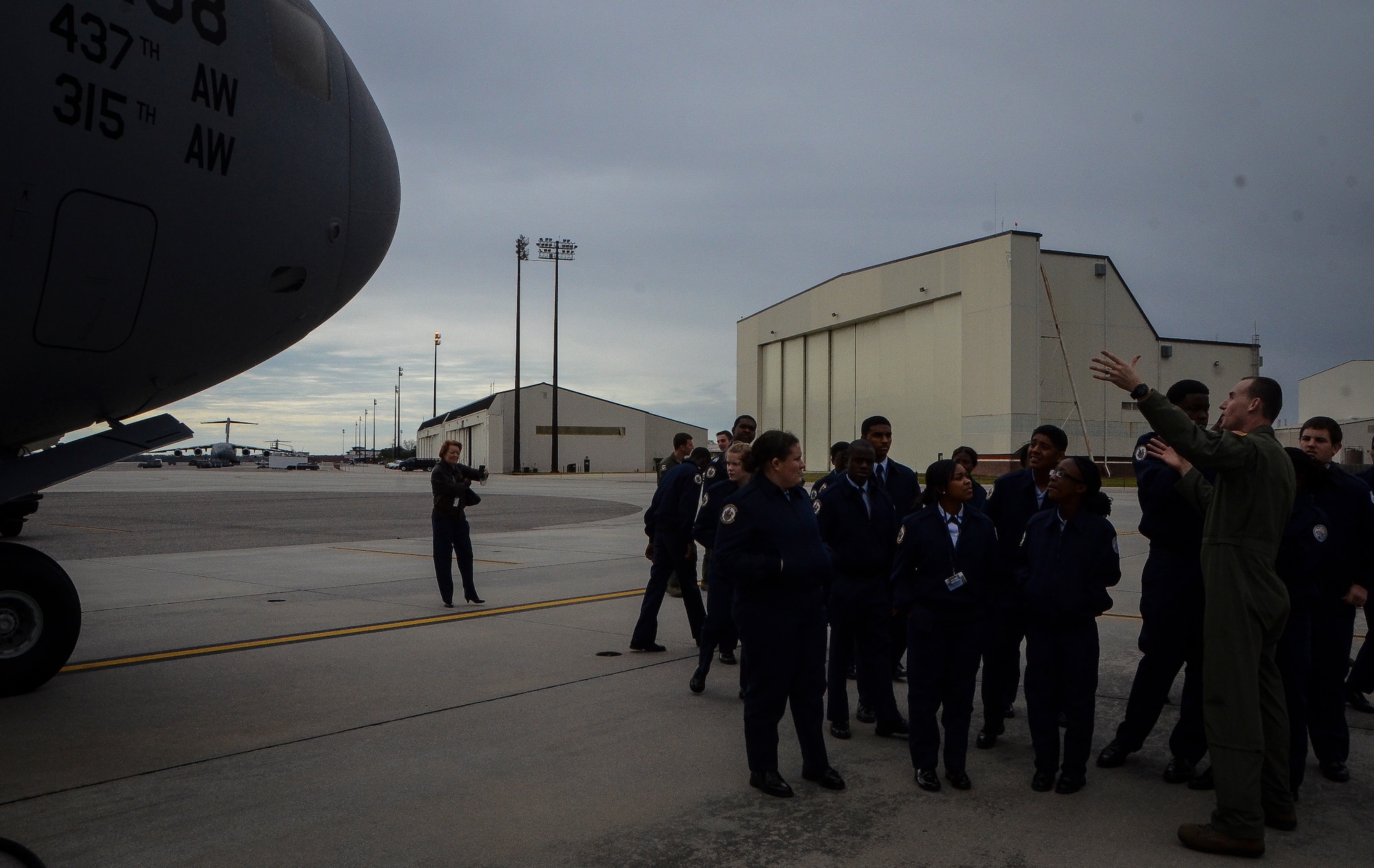 Captain. C.J. Burdon, 16th Airlift Squadron pilot, explains the capabilities of the C-17 Globemaster III to U.S. Air Force Junior Reserve Officer Training Corps students from R.B. Stall High School Feb. 19, 2013, at Joint Base Charleston – Air Base, S.C.  More than 20 students visited the air base to get a firsthand experience of what Airmen do on a day-to-day basis. These tours help endorse strong community ties to the local population and help recruit future leaders of tomorrow’s Air Force. (U. S. Air Force photo/Airman 1st Class Jared Trimarchi) 