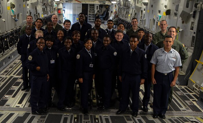 U.S. Air Force Junior Reserve Officer Training Corps students from R.B. Stall High School gather for a group photo with Airmen from the 16th Airlift Squadron Feb. 19, 2013, aboard a C-17 Globemaster III at Joint Base Charleston – Air Base, S.C.  More than 20 students visited the air base to get a firsthand experience of what Airmen do on a day-to-day basis. These tours help endorse strong community ties to the local population and help recruit the future leaders of tomorrow’s Air Force. (U. S. Air Force photo/Airman 1st Class Jared Trimarchi) 