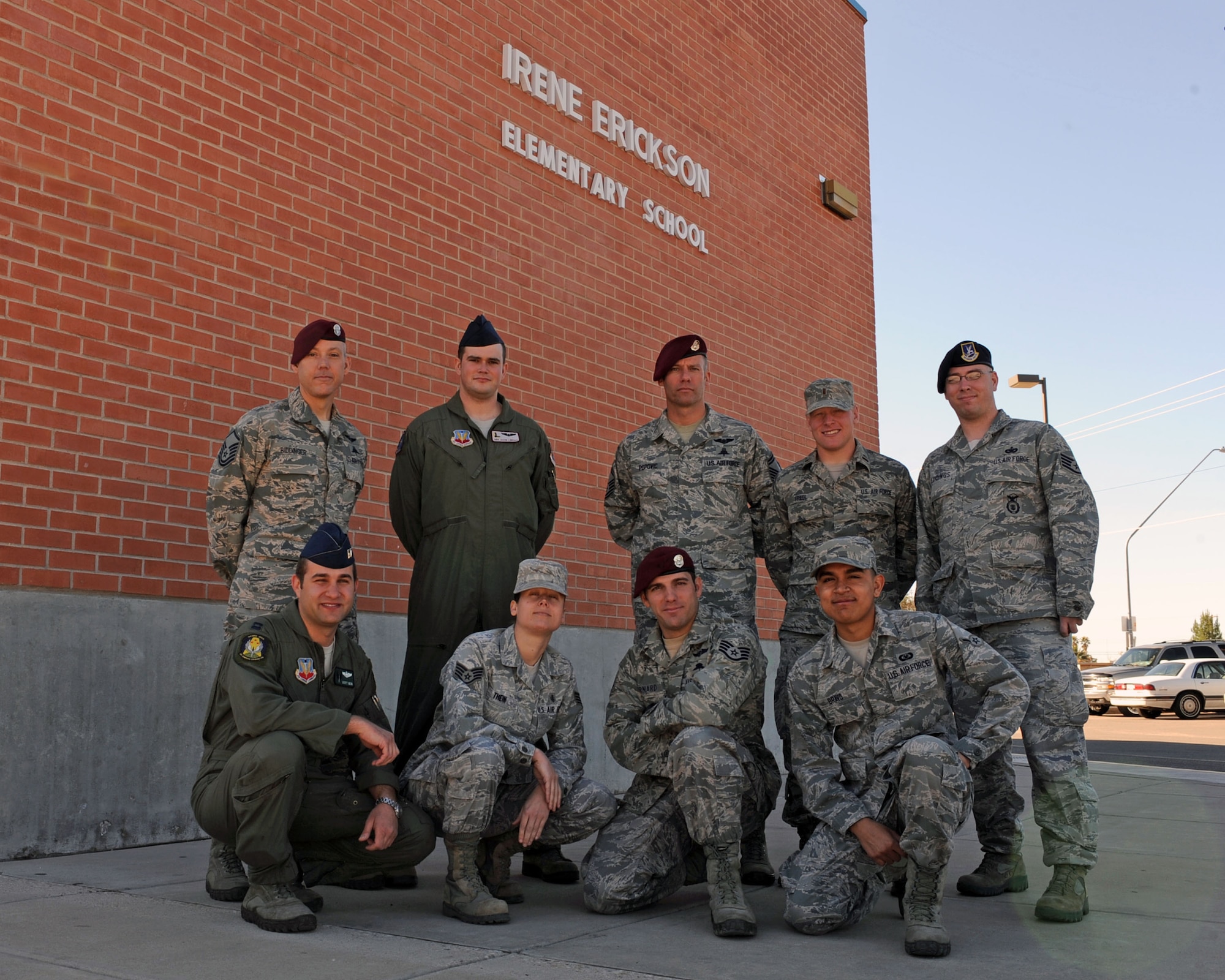 U.S. Air Force 48th Rescue Squadron Airmen pose for a photo in front of Irene Erickson Elementary School in Tucson, Ariz., Feb. 13, 2013. Airmen from the 48th participate in volunteer events on a monthly basis. (U.S. Air Force photo by Airman 1st Class Christine Griffiths/Released) 