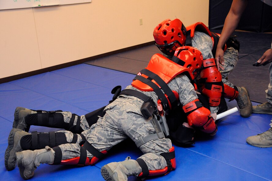 Senior Airmen Mauricio Esteves and Aldo Felici, 2nd Security Forces Squadron, apply what they learned from their expandable baton training course on Barksdale Air Force Base, La., Feb. 15. After the classroom portion was completed, Airmen were challenged with various scenarios in which they had to use the techniques learned during the class. (U.S. Air Force photo/Airman 1st Class Andrew Moua)