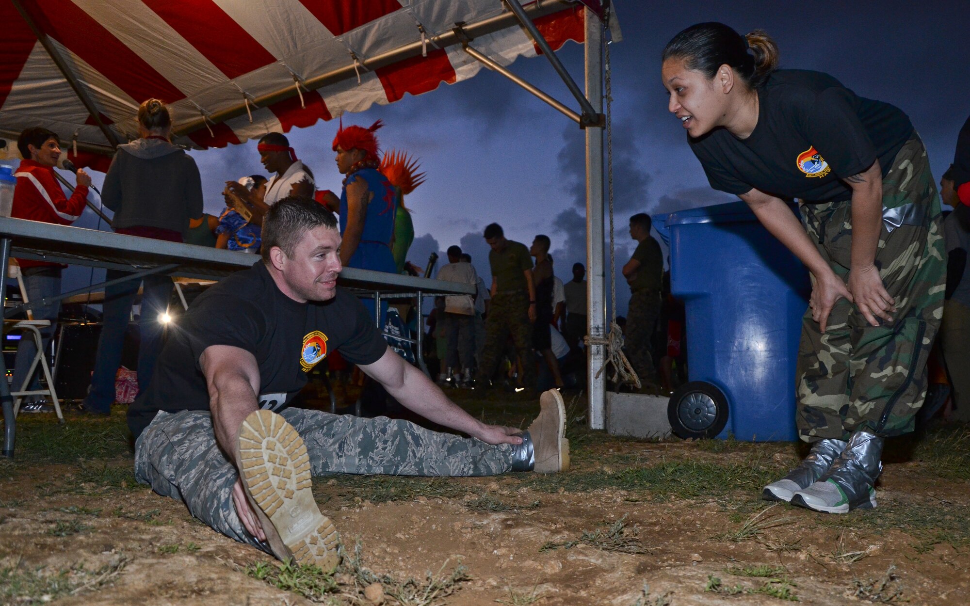 From left, Tech. Sgt. Sean R. Warnet and Tech. Sgt. Jahnna K. Burns, air transportation craftsmen with the 48th Aerial Port Squadron, 624th Regional Support Group, Joint Base Pearl Harbor-Hickam, Hawaii, stretch in preparation for the 19th Annual Swamp Romp, at Marine Corps Base Hawaii, Kaneohe Bay, Hawaii, Saturday, Feb. 16, 2013. The two “port dawgs” were part of a 6-person team competing in the 5-mile footrace, affectionately called “the dirtiest race of the year.” The race is open to service members and civilians, and takes runners through mud, water, dirt and sand, over and under obstacles that challenge even the fittest of the fit. The Swamp Romp is one of eleven races that make up the MCBH Commanding Officer’s Fitness Series. (U.S. Air Force photo/Tech. Sgt. Phyllis E. Keith)