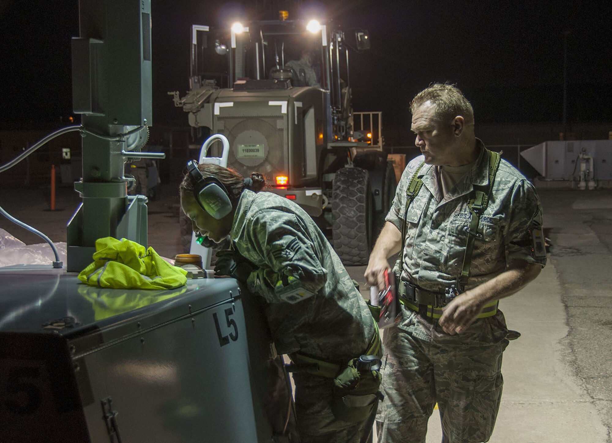 Members of the 349th Air Mobility Wing and 60th AMW worked together during an Operational Readiness Inspection during the week of February 4, at the Combat Readiness Training Center in Gulfport, Miss. ORI's are intended to test Airmen on their ability to deploy at a moments notice and be fully capable of establising and maintaining a base under various threat conditions while in chemical warfare mission oriented protective equipment. (U.S. Air Force photo)
