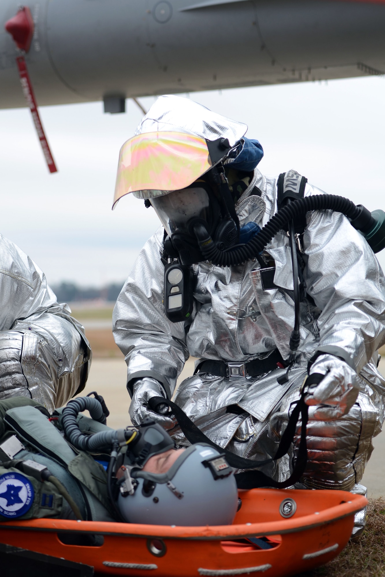 Firefighters with the 169th Civil Engineering Squadron at McEntire Joint National Guard Base, S.C., train to remove a pilot from the cockpit of an F-16 Block 52 figher jet Feb. 8, 2013. The aircrew extraction training measures how quickly and safely emergency rescue personnel can remove an incapacitated pilot from a plane during an Operational Readiness Exercise. The 169th Fighter Wing is training for an upcoming Operational Readiness Inspection later this year. 
(National Guard photo by Tech. Sgt. Caycee Watson/Released)
