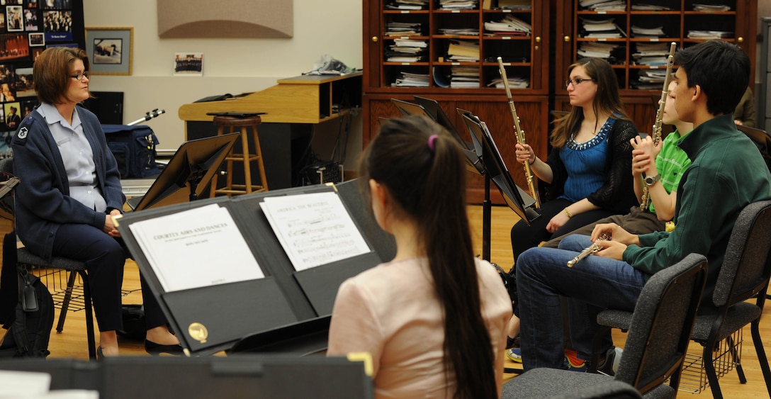 Master Sgt. Jennifer Moore-Tersero, U.S. Air Force Band flutist, leads a flute sectional with students from the InterSchool Orchestra from N.Y., on Feb. 16, 2013, on Joint Base Anacostia-Bolling, D.C. Members of the Air Force Band volunteered to coach the students for their performance in D.C. the following day. (U.S. Air Force photo/Senior Airman Bahja Joi Jones)