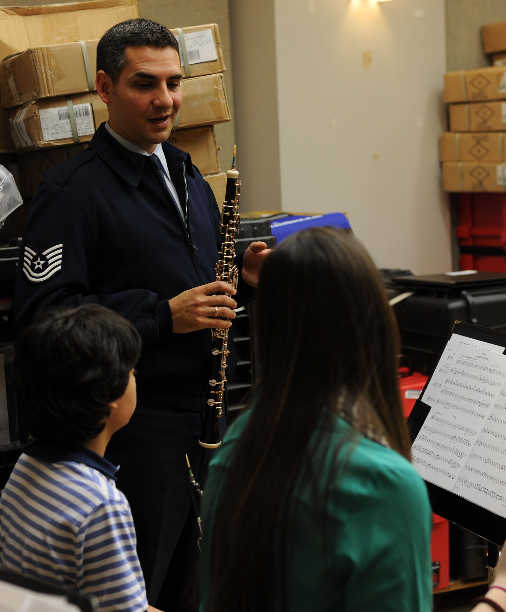 Tech Sgt. Kevin Darrow, U. S. Air Force Band Oboist, advises the students from the InterSchool Orchestra from N.Y., during a workshop Feb. 16, 2013, on Joint Base Anacostia-Bolling, D.C. Members of the Air Force Band volunteered to coach the students for their performance in D.C. the following day. (U.S. Air Force photo/Senior Airman Bahja Joi Jones)