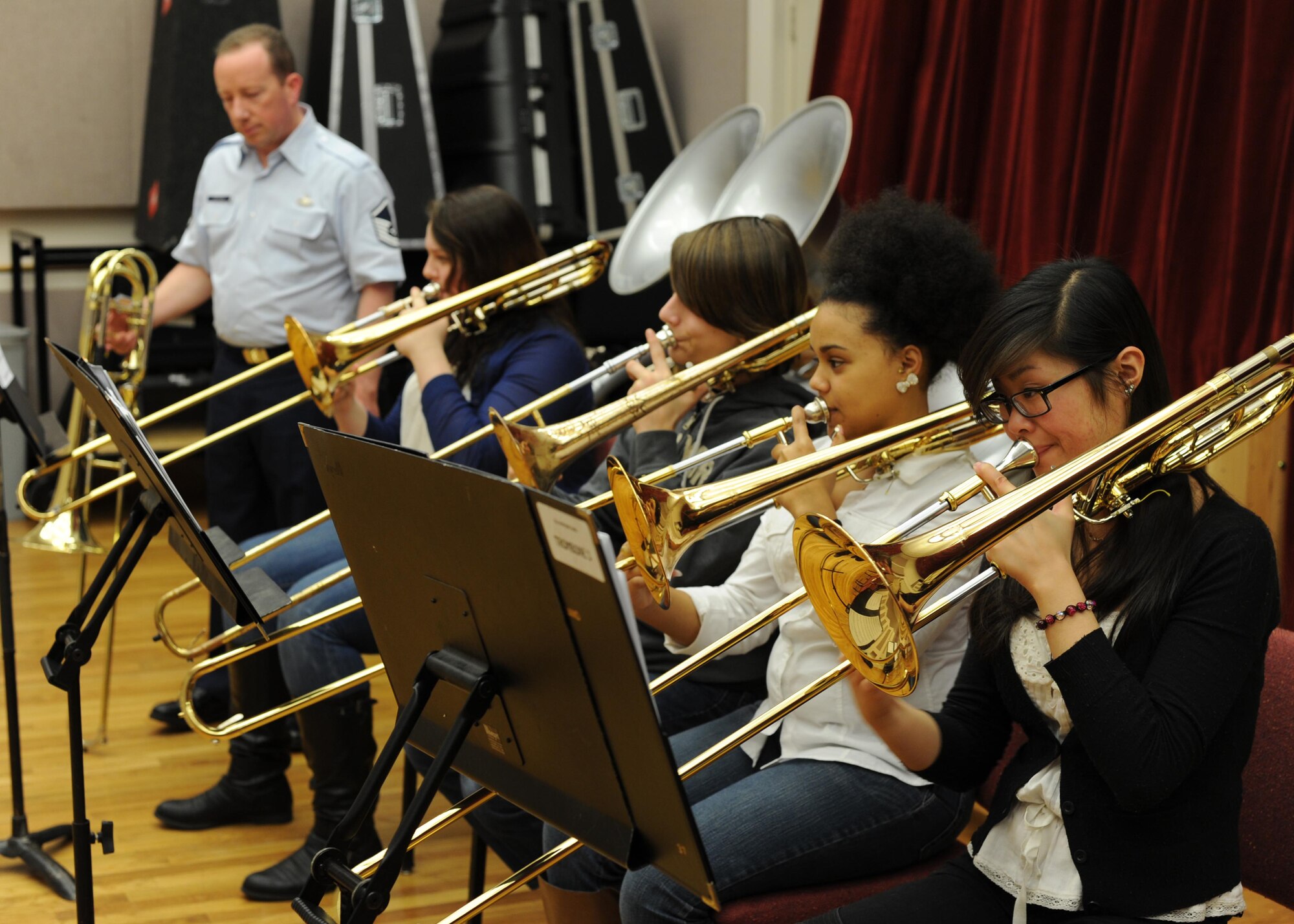 Students from the InterSchool Orchestra from N.Y., rehearse in a trombone sectional lead by Master Sgt. Jay Heltzer, U.S. Air Force Band trombonist, during a workshop Feb. 16, 2013, on Joint Base Anacostia-Bolling, D.C. Members of the Air Force Band volunteered to coach the students for their performance in D.C. the following day. (U.S. Air Force photo/Senior Airman Bahja Joi Jones)