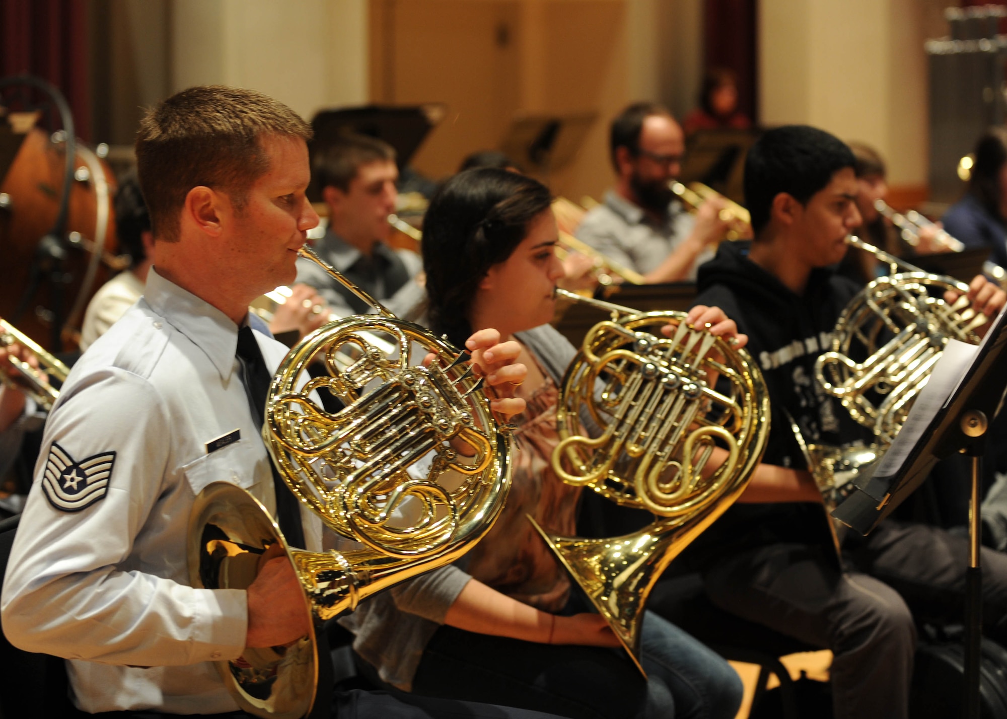 Tech Sgt. Joel Wealer, U.S. Air Force Band French horn player, rehearses with students from the InterSchool Orchestra in N.Y., during a workshop Feb. 16, 2013, on Joint Base Anacostia-Bolling, D.C. Members of the Air Force Band volunteered to coach the students for their performance in D.C. the following day. (U.S. Air Force photo/Senior Airman Bahja Joi Jones)