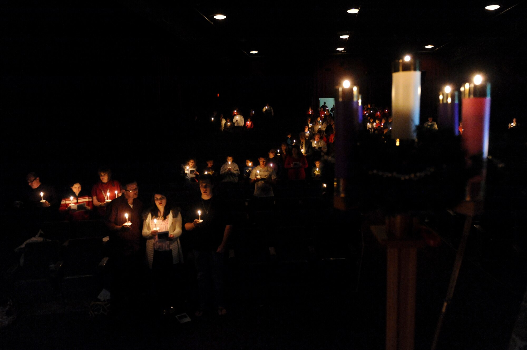 Team Little Rock members participate in a candle light service Dec. 24, 2012, at Little Rock Air Force Base, Ark. The candle light service was held to celebrate Christmas. (U.S. Air Force photo by Airman 1st Class Rusty Frank)