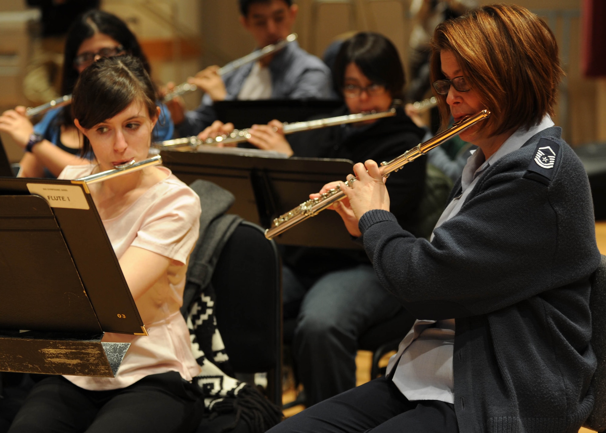Master Sgt. Jennifer Moore-Tersero, U.S. Air Force Band flutist, rehearses with the students of the InterSchool Orchestra from N.Y., during a workshop Feb. 16, 2013, on Joint Base Anacostia-Bolling, D.C. Members of the Air Force Band volunteered to coach the students for their performance in D.C. the following day. (U.S. Air Force photo/Senior Airman Bahja Joi Jones)