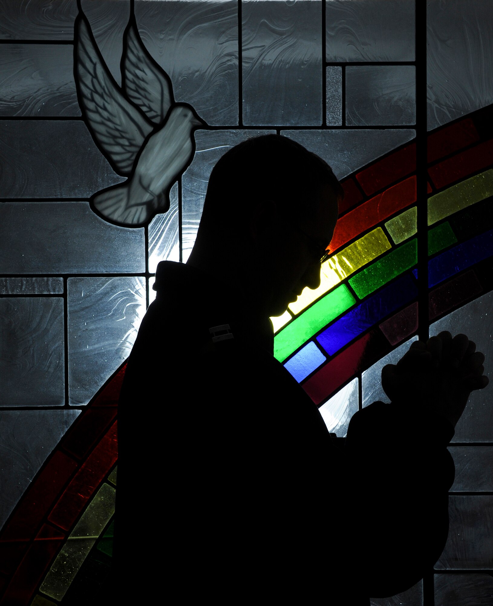 Chaplain (Capt.) Garrell Calton, a 19th Airlift Wing chaplain, prays Dec. 13, 2012, at Little Rock Air Force Base, Ark. Calton is one of four chaplains stationed at LRAFB.(U.S. Air Force photo by Airman 1st Class Rusty Frank)