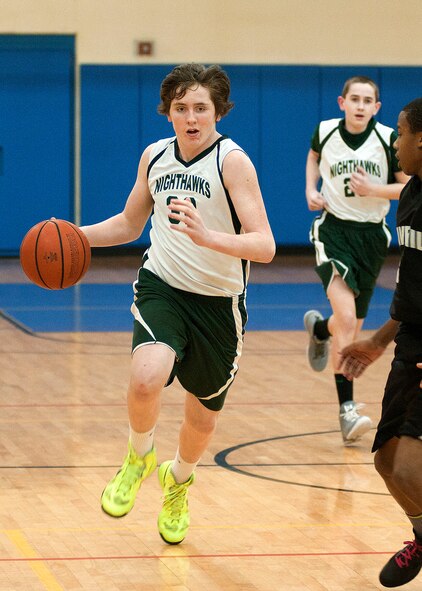 HANSCOM AIR FORCE BASE, Mass. – Steven Lambert from the Nashua Nighthawks drives the basketball up the floor during a game against Haverhill at the Fitness and Sports Center Feb. 15. Eighth grade teams participated in the fourth annual President’s Day weekend basketball tournament, hosted by the 66th Force Support Squadron Youth Programs. The competition featured four teams from around the Hanscom area. The Nighthawks captured the top honors with an 82-61 win over Chelmsford in the championship game. (U.S. Air Force photo by Mark Wyatt)