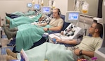 Soldiers, Sailors and Airmen become “blood brothers and sisters” during their platelet donation at the Akeroyd Blood Donor Center. (Photo by Mark Salcedo, Akeroyd Blood Donor Center)
