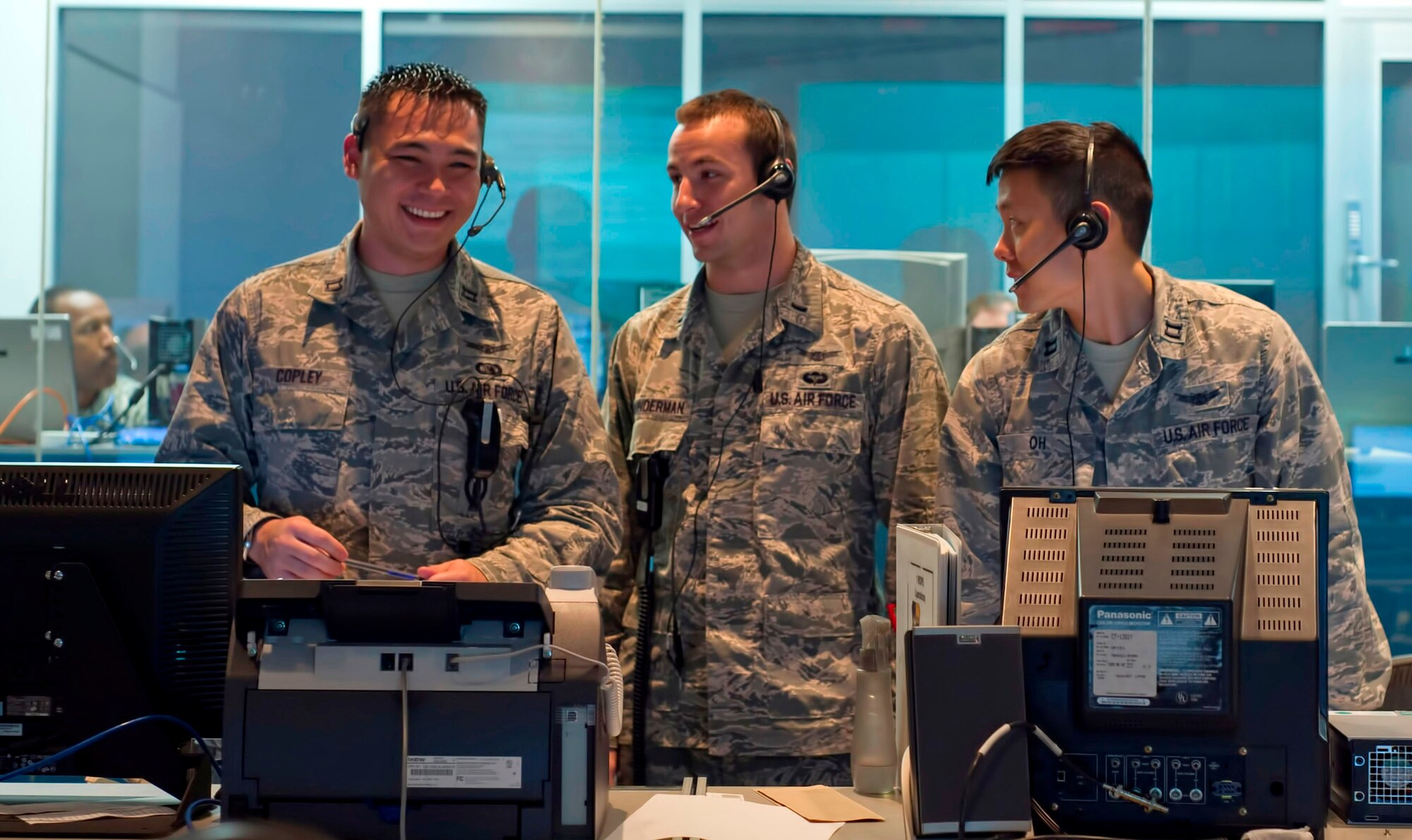 Capt. Robert H. Copley, far left, and Capt. Jason Oh, far right, both assigned to the 1st Range Operations Squadron, 45th Space Wing, are 13S's. It was recently announced that the Air Force Air has split the space and missile career field in an effort to ensure more focused development for officers performing these critical missions in increasingly complex operational environments. In the center is 1st Lt. Adam Brunderman, an acquisitions officer.  
(U.S. Air Force Photo/Matthew Jurgens)