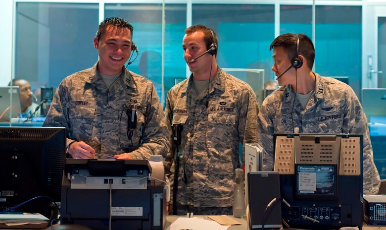 Capt. Robert H. Copley, far left, and Capt. Jason Oh, far right, both assigned to the 1st Range Operations Squadron, 45th Space Wing, are 13S's. It was recently announced that the Air Force Air has split the space and missile career field in an effort to ensure more focused development for officers performing these critical missions in increasingly complex operational environments. In the center is 1st Lt. Adam Brunderman, an acquisitions officer.  
(U.S. Air Force Photo/Matthew Jurgens)