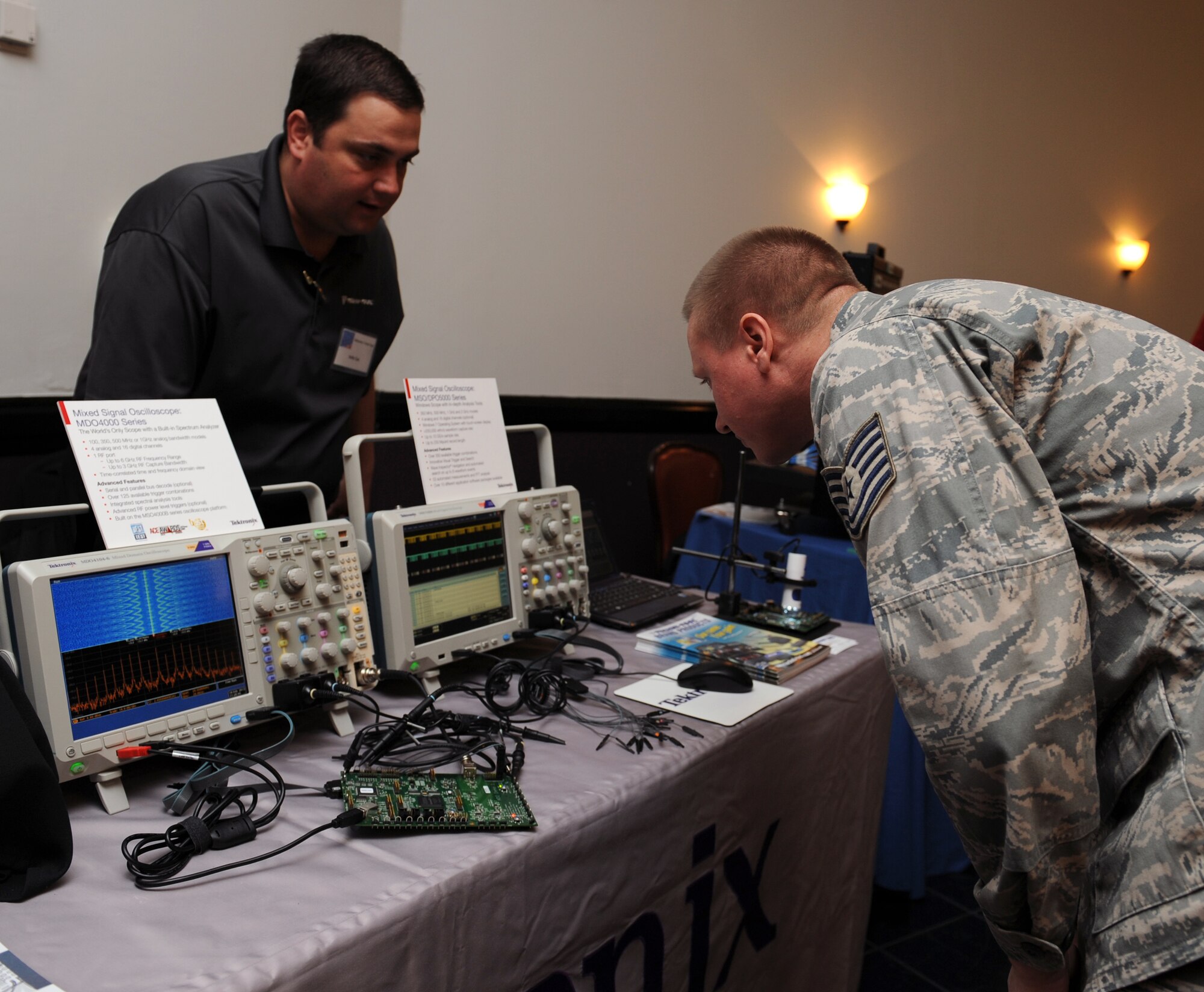 Tech. Sgt. Thomas Hoover, 608th Air Communications Squadron, watches an oscilloscope at the Information Technology Expo on Barksdale Air Force Base, La., Feb. 19. An oscilloscope is used to measure various channels of analog and digital signals. (U.S. Air Force photo/Airman 1st Class Benjamin Gonsier)
