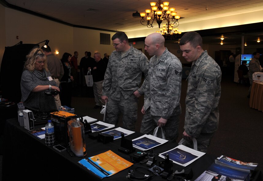 Members of Team Barksdale look at a display at the Information Technology Expo on Barksdale Air Force Base, La., Feb. 19. The exposition gave members of Team Barksdale the opportunity to view the latest technology the industry has to offer for military and personal use. (U.S. Air Force photo/Airman 1st Class Benjamin Gonsier)