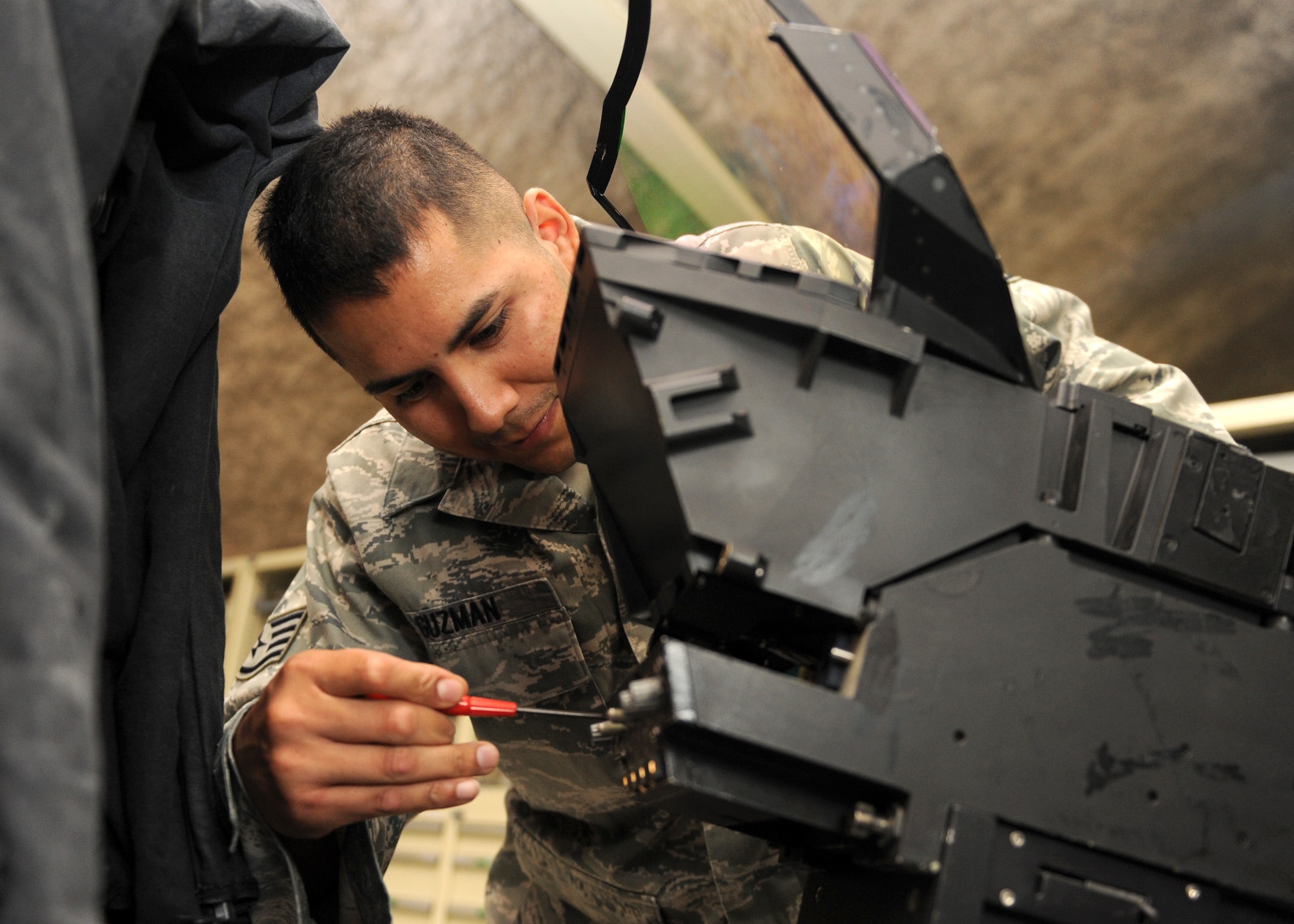 SOUTHWEST ASIA - Staff Sgt. Rodolfo Guzman, 379th Expeditionary Maintenance Squadron, repairs a heads-up-display for an F-15 Feb. 19. The avionics shop has Airmen who specialize in multiple air platforms and are the only central repair facility for the equipment in the U.S. Central Command area of responsibility. Guzman is deployed from the 48th Component Maintenance Squadron at Royal Air Force Lakenheath, United Kingdom. (U.S. Air Force photo/Senior Airman Joel Mease) 