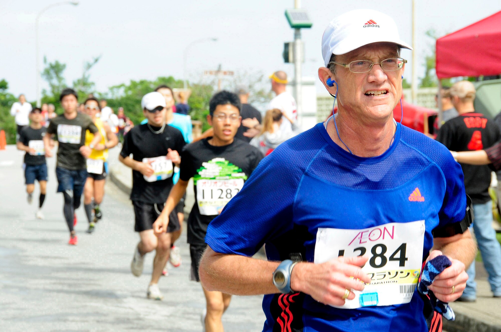 Participants run through Kadena Air Base, Japan, during the 2013 Okinawa Marathon on Feb. 17, 2013. More than 11,000 runners participated, including more than 160 service members from across the island. This year 8,576 runners finished the race with a 78 percent completion rate. (U.S. Air Force photo/Staff Sgt. Darnell T. Cannady)
