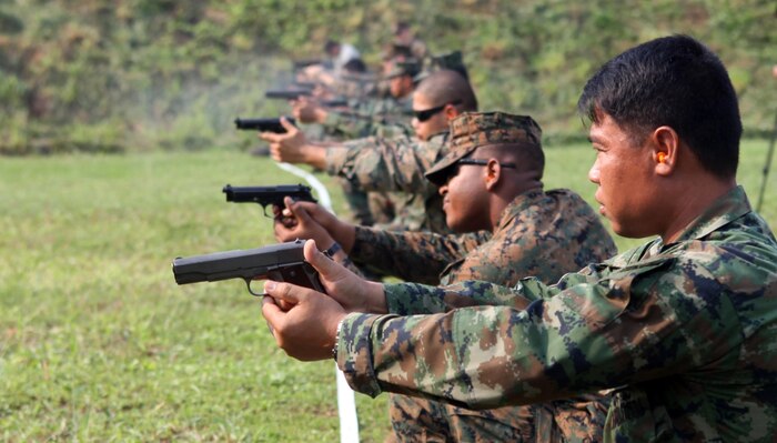 U.S. Marines from Combat Logistics Regiment 3 conducted a bilateral pistol shoot with Royal Thai Marines Feb. 16 in Sattahip, Chonburi province, Kingdom of Thailand, to further their military relationship during exercise Cobra Gold 2013. The exercise is a Thai-U.S. co-sponsored multinational, multiservice exercise giving forces from Thailand, the U.S., Singapore, Japan, Republic of Korea, Indonesia, Malaysia and observer nations, an opportunity to strengthen military-to-military relations and enhance interoperability. CLR-3 is part of 3rd Marine Logistics Group, III Marine Expeditionary Force.