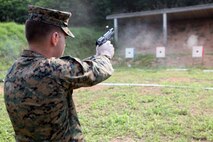 U.S. Marine Lance Cpl. Kirby A. Smith, a cyber network operator fires his M9 service pistol during a bilateral shoot with Royal Thai Marines Feb. 16 in Sattahip, Chonburi province, Kingdom of Thailand, during exercise Cobra Gold 2013. Smith is with Combat Logistics Regiment 3, 3rd Marine Logistics Group, III Marine Expeditionary Force. CG 13, in its 32nd iteration, demonstrates U.S. commitment to its long-standing ally the Kingdom of Thailand, and toward regional partnership, prosperity and security in the Asia-Pacific region.