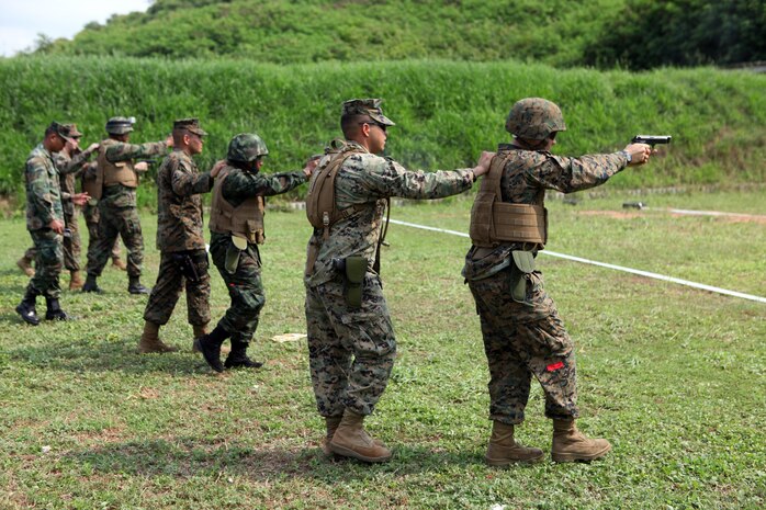 U.S. Marines from Combat Logistics Regiment 3 conducted a bilateral pistol shoot with Royal Thai Marines Feb. 16 in Sattahip, Chonburi province, Kingdom of Thailand, to further their military relationship during exercise Cobra Gold 2013. The exercise is a Thai-U.S. co-sponsored multinational, multiservice exercise giving forces from Thailand, the U.S., Singapore, Japan, Republic of Korea, Indonesia, Malaysia and observer nations, an opportunity to strengthen military-to-military relations and enhance interoperability. CLR-3 is part of 3rd Marine Logistics Group, III Marine Expeditionary Force.