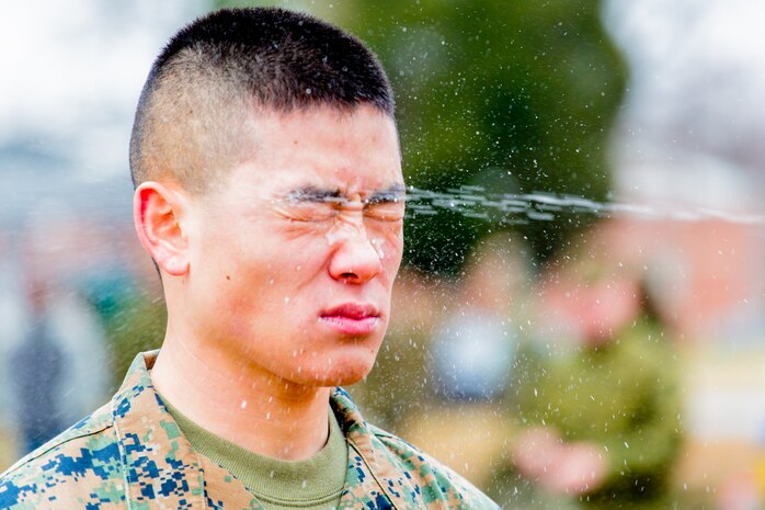 Cpl. Anthony Kim of the Quantico Band is sprayed in the face with OC spray, also known as pepper spray, during the band’s OC and baton certification Feb. 7. 