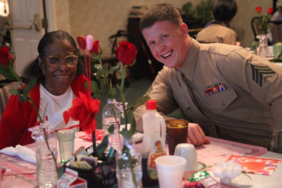Twenty Marines from the Air Station and Marine Corps Recruit Depot Parris Island spent time speaking and enjoying a meal at River Oaks Residential Care in Beaufort, S.C., Valentines Day. Each Marine would deliver a rose to one of the residents and escort them to the dining area for lunch. 
