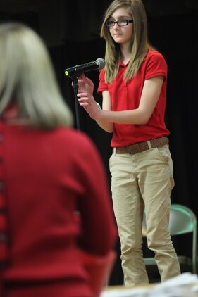 Maddy Long, the second place competitor of the Bolden Elementary/Middle School Spelling Bee, spells to proceed to the next round of the competition, Feb. 14. Long was bested by Danil Ryley, the Spelling Bee winner, after he spelled the challenge word, algorithm. 