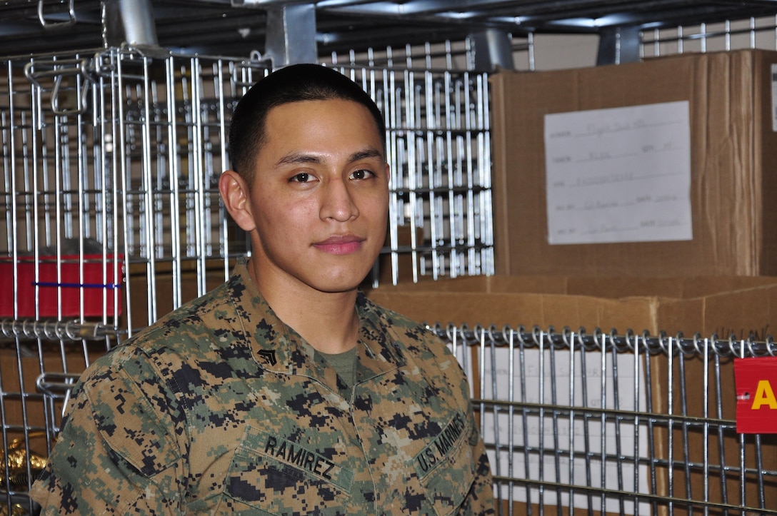 Cpl. Michael Ramirez, Headquarters and Service Battalion's Noncommissioned Officer of the 4th Quarter and Noncommissioned Officer of the Year, stands in front of one of the bins in Security Battalion's warehouse. Ramirez is currently the Security Bn. warehouse chief.