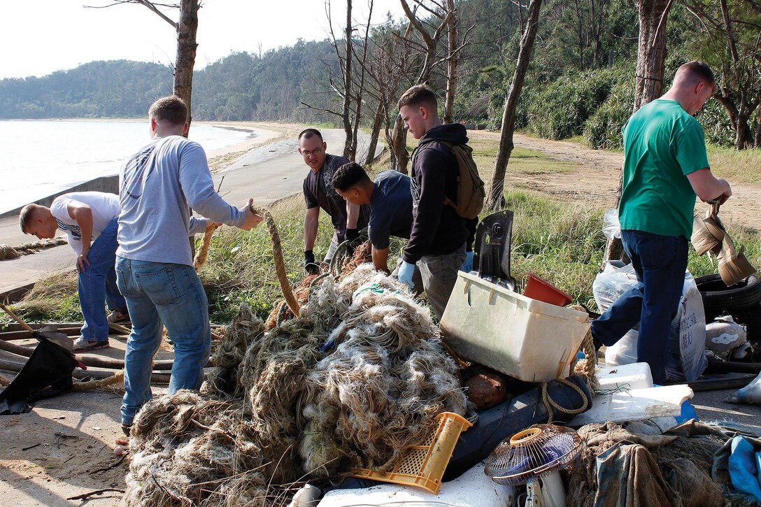 Marines with 7th Communication Battalion sort through debris collected Feb. 14 while cleaning the shoreline  of a bay in Kin Town near the Hikarigaoka nursing home.  “It’s a great pleasure to see what the Marines do to help out the local community,” said Chiemi Okuma, the office manager for Hikarigaoka nursing home. “I am very grateful and can’t wait for them to come visit and help out once again.” 7th Comm. Bn. is a part of III Marine Expeditionary Force Headquarters Group, III MEF.