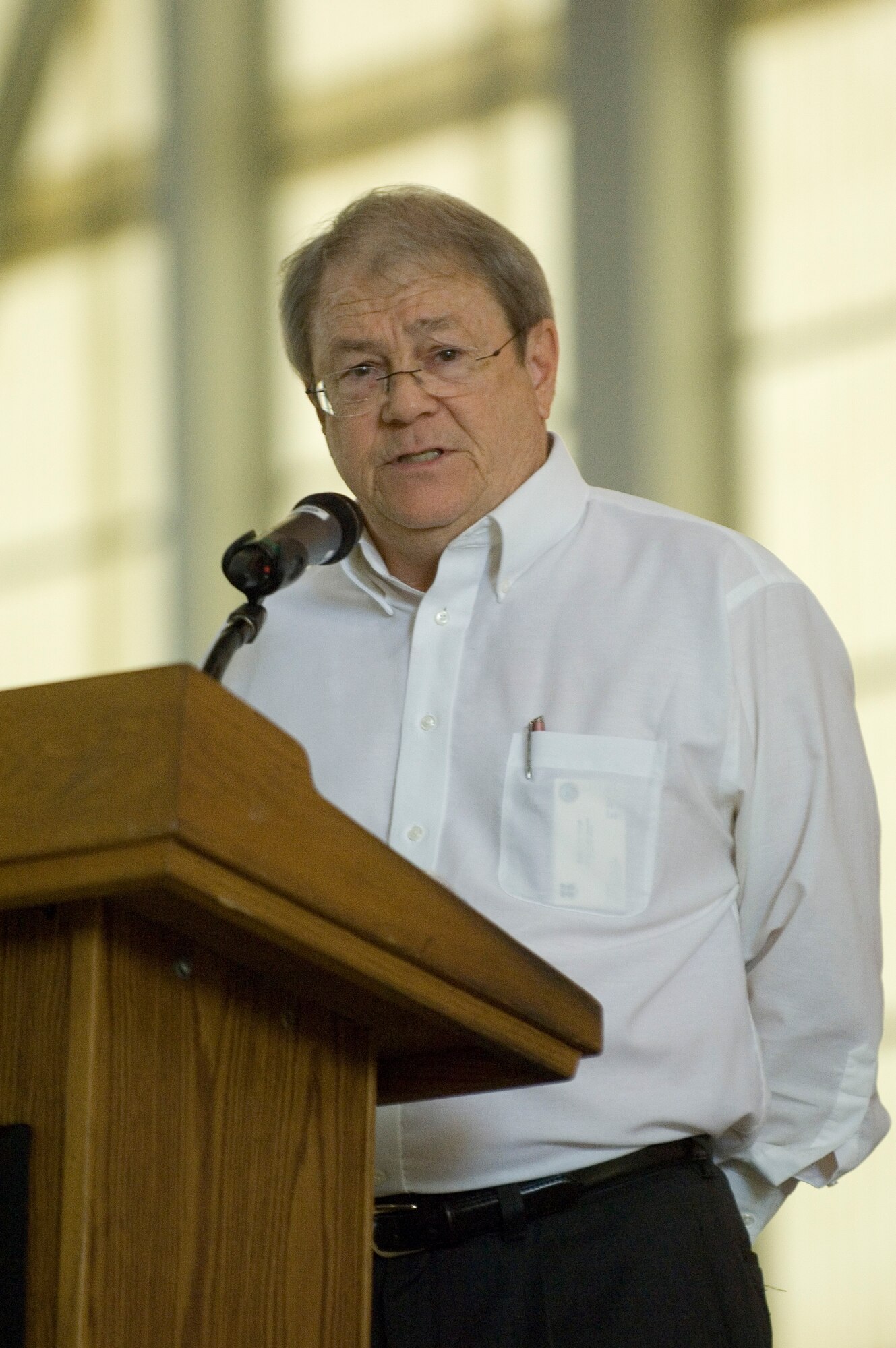 Bob Wood, Environmental Management director, speaks at the 65th anniversary of the Air Force Flight Test Center in Hangar 1600 Oct. 14, 2011. (U.S. Air Force photo)
