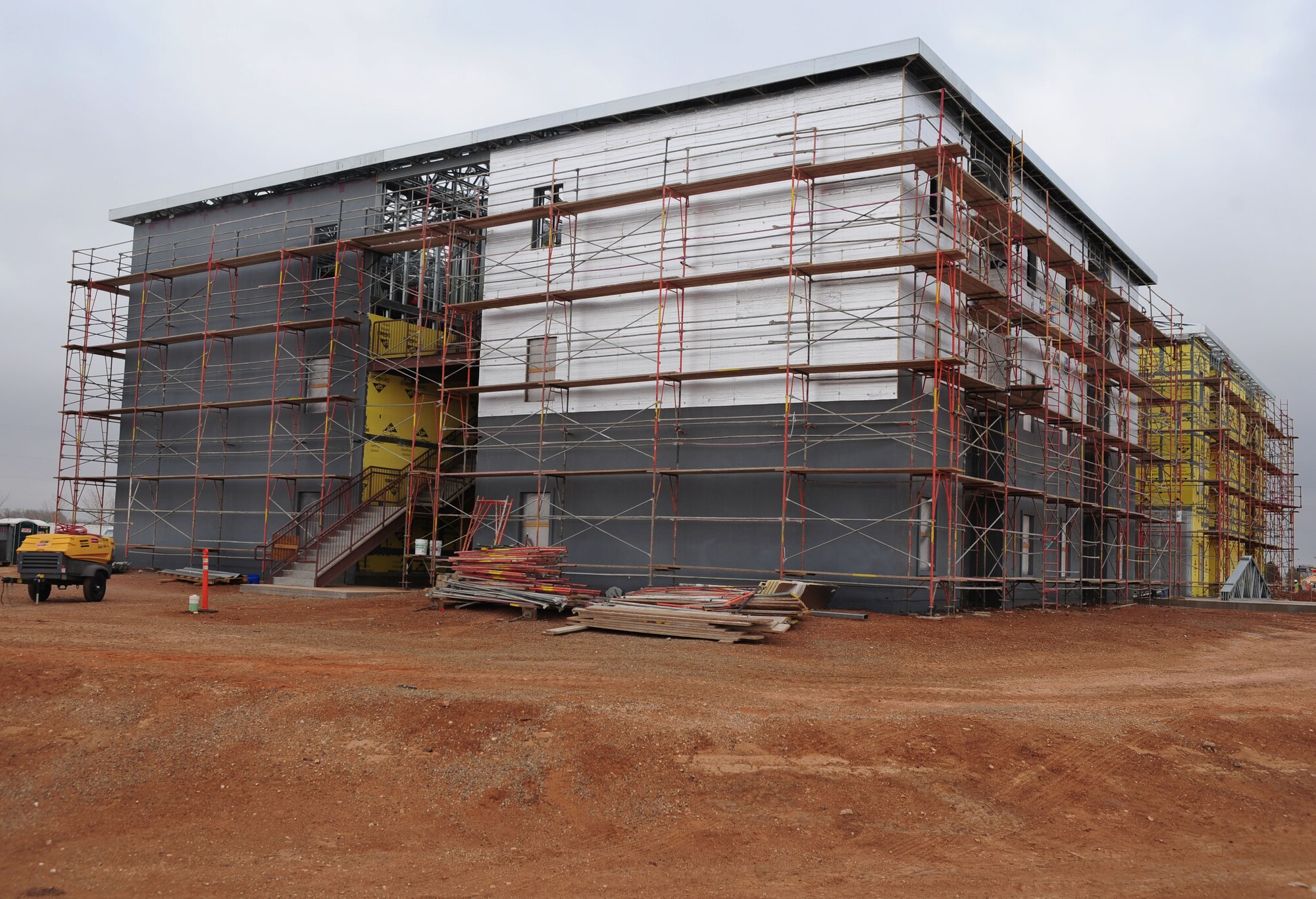 One of the new dorms currently under construction sits on its lot at Cannon Air Force Base, N.M., Feb. 20, 2013. The 96-person dorms have been under construction since August of 2012 and one is expected to be completed later this year. (U.S. Air Force photo/Airman 1st Class Ericka Engblom)