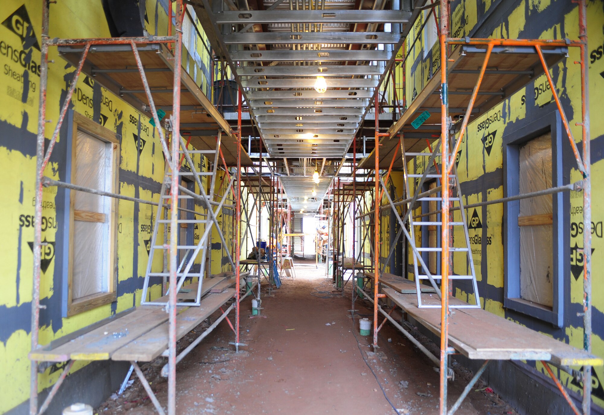 The new dorms currently under construction have gained walls and interior lighting at Cannon Air Force Base, N.M., Feb. 20, 2013. The 96-person dorms have been under construction since August of 2012 and one is expected to be completed later this year. (U.S. Air Force photo/Airman 1st Class Ericka Engblom)