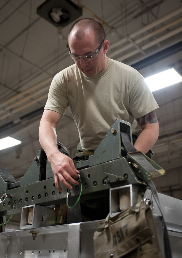 Tech Sgt. Robert Holyoke, 28th Munitions Squadron support equipment technician, performs a 365 day inspection on an aluminum rail set trailer at Ellsworth Air Force Base, S.D., Feb. 7, 2013. Each aluminum rail set trailer must be inspected annually to ensure it is serviceable. (U.S. Air Force photo by Airman 1st Class Alystria Maurer/Released)
