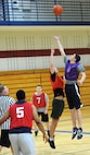 Airman 1st Class Joshua Jordan, 28th Logistics Readiness Squadron fuels distribution operator, jumps to gain control of the ball during the base 2013 Intramural Basketball League tournament in the Bellamy Fitness Center at Ellsworth Air Force Base, S.D., Feb. 19, 2013. The 28th LRS squared off against the 28th Force Support Squadron, and won, 40-33. (U.S. Air Force photo by Airman 1st Class Hrair H. Palyan/Released)