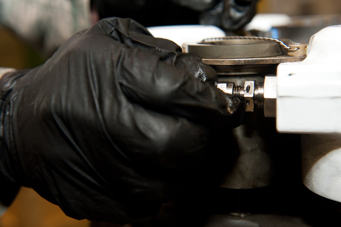 Senior Airman Ian McHaley, 28th Maintenance Squadron hydraulics technician, inspects safety wire on a B-1 brake system prior to shipment at the 28th MXS Hydraulics Shop on Ellsworth Air Force Base, S.D., Feb. 15, 2013. The wires are used to secure fittings, bolts and screws to prevent the possibility of damage from foreign objects and debris. (U.S. Air Force photo by Airman 1st Class Kate Thornton-Maurer/Released)