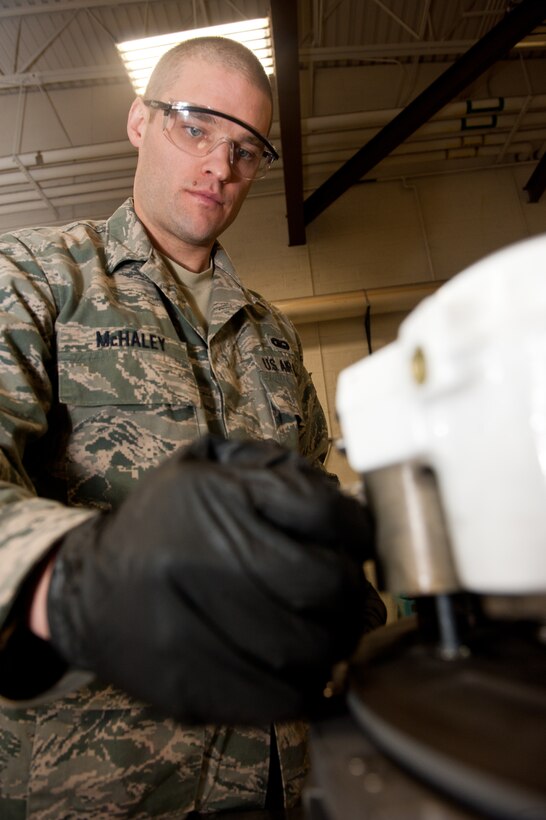Senior Airman Ian McHaley, 28th Maintenance Squadron hydraulics technician, caps off hydraulic ports on a B-1 brake system to prepare it for shipment on Ellsworth Air Force Base, S.D., Feb. 15, 2013. Capping the ports prevents hydraulic fluid from leaking out and eliminates the possibility of contamination, ensuring proper and timely maintenance. (U.S. Air Force photo by Airman 1st Class Kate Thornton-Maurer/Released)